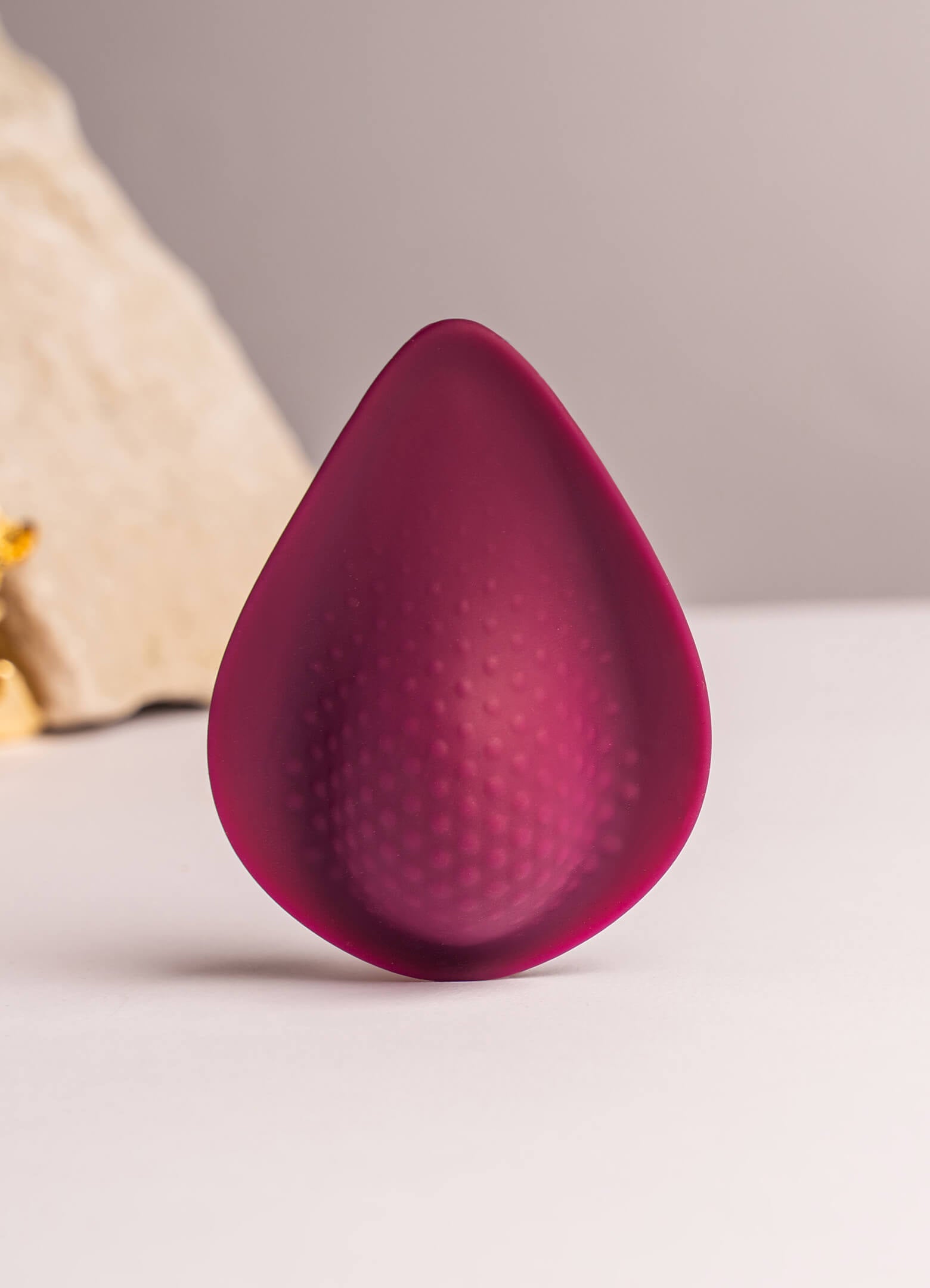 Discreet tear drop shaped silicone panty vibe in burgundy.