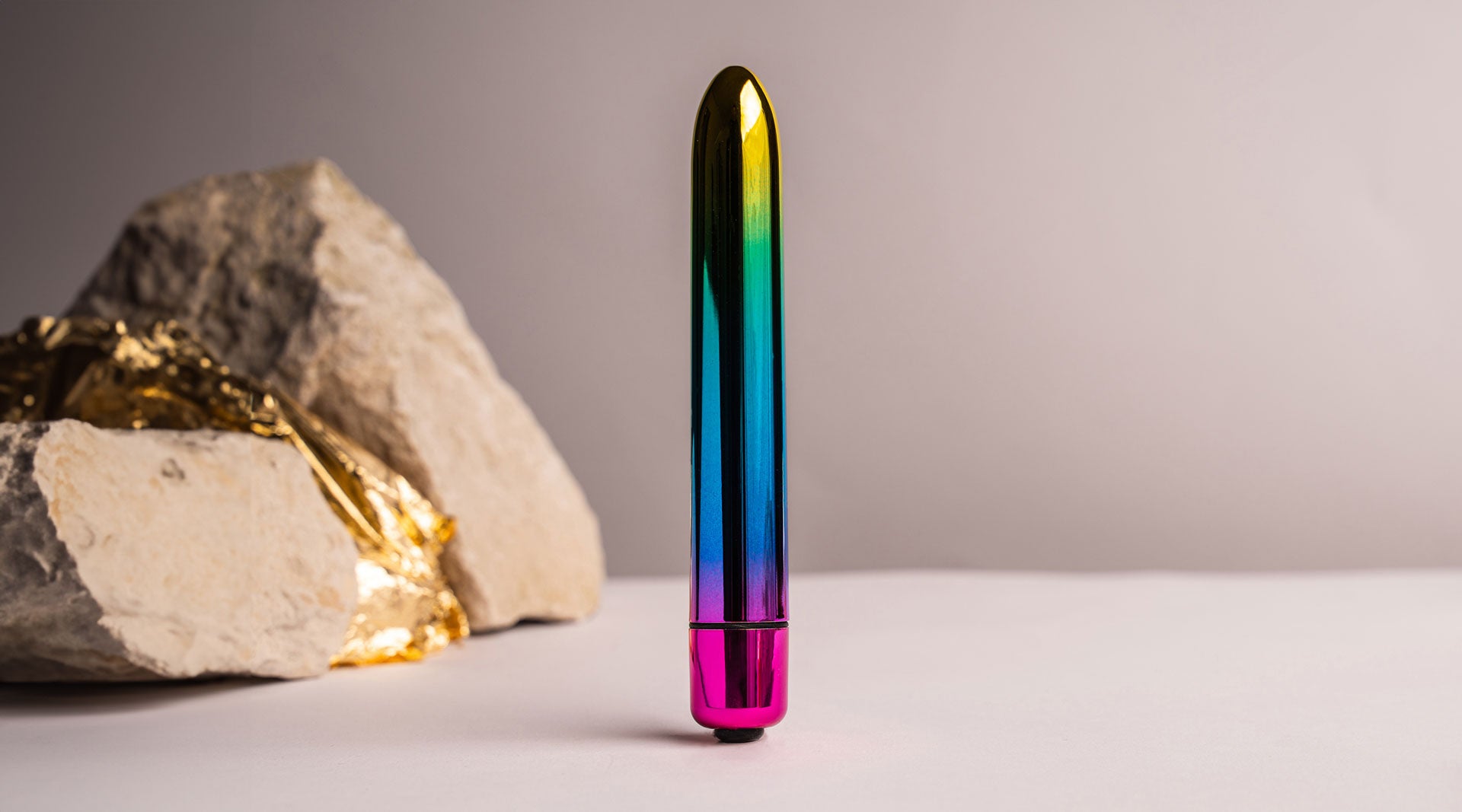 Medium sized insertable bullet vibrator in rainbow chrome colour.