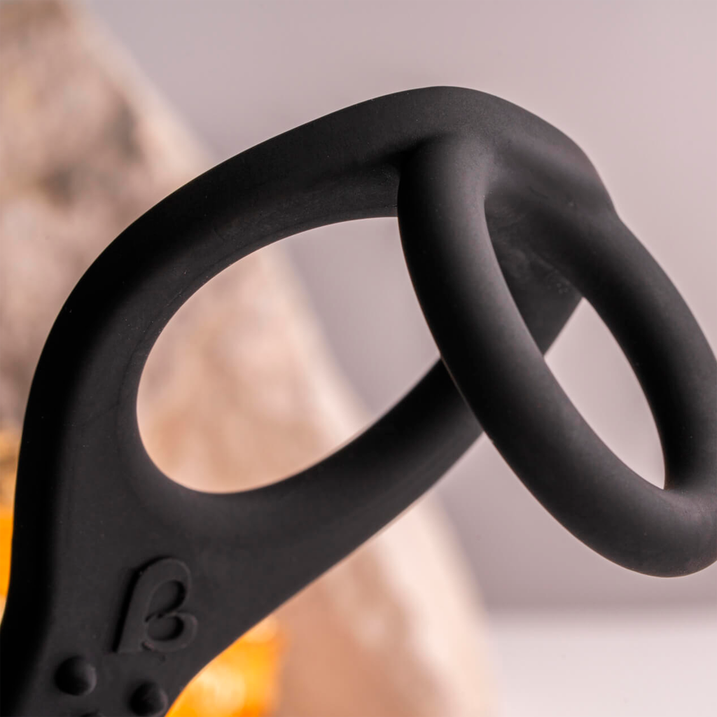 Black silicone ring and curved handle with raised 'B' mark and small nubs