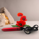 Whisper-quiet travel vibrator showing magnetic USB charging points and waterproof seal