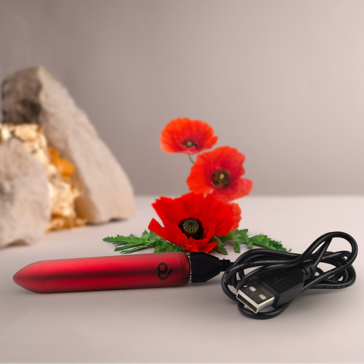 Whisper-quiet travel vibrator showing magnetic USB charging points and waterproof seal