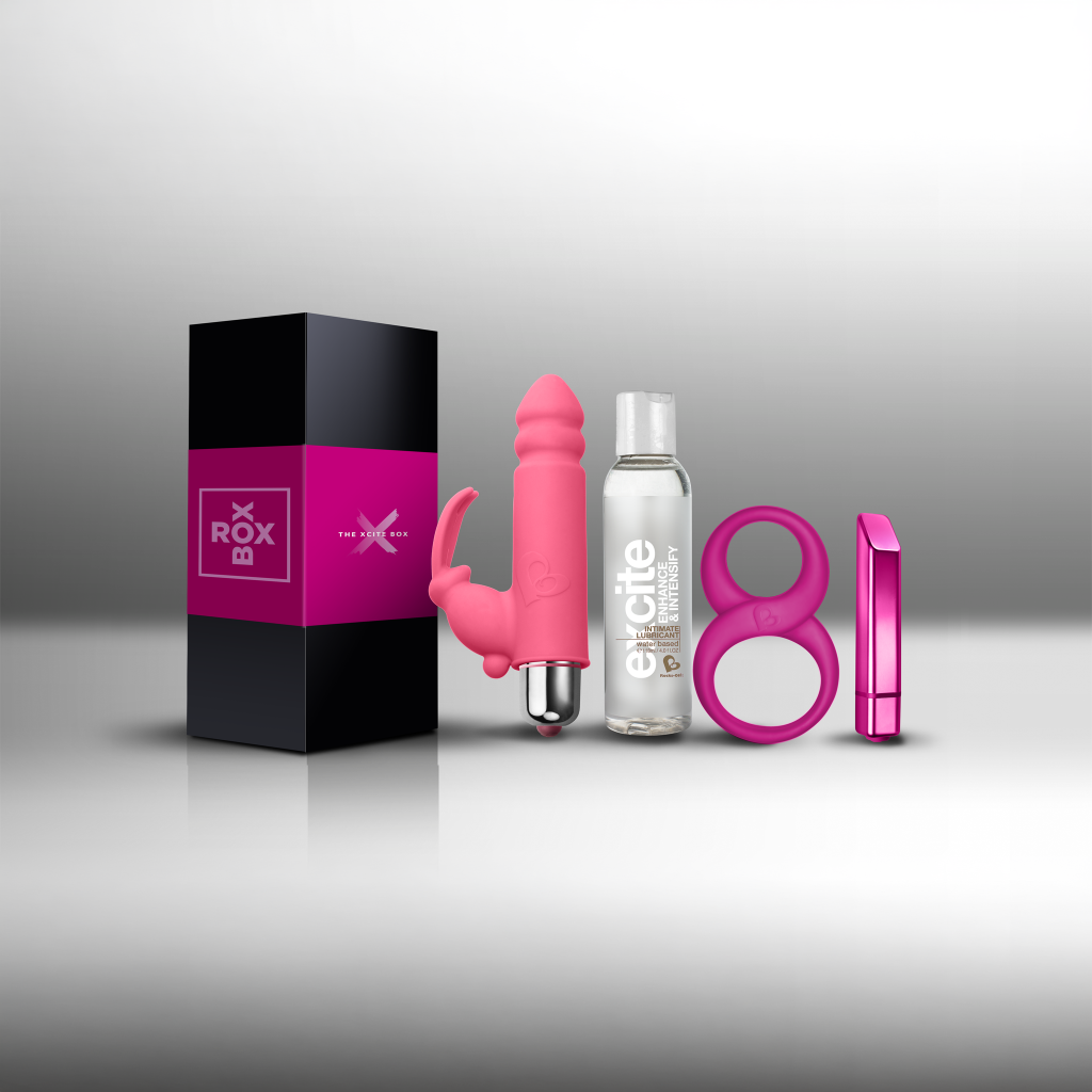 Naughty pleasure kit with pink vibrator, lube bottle, cock ring, and gift box