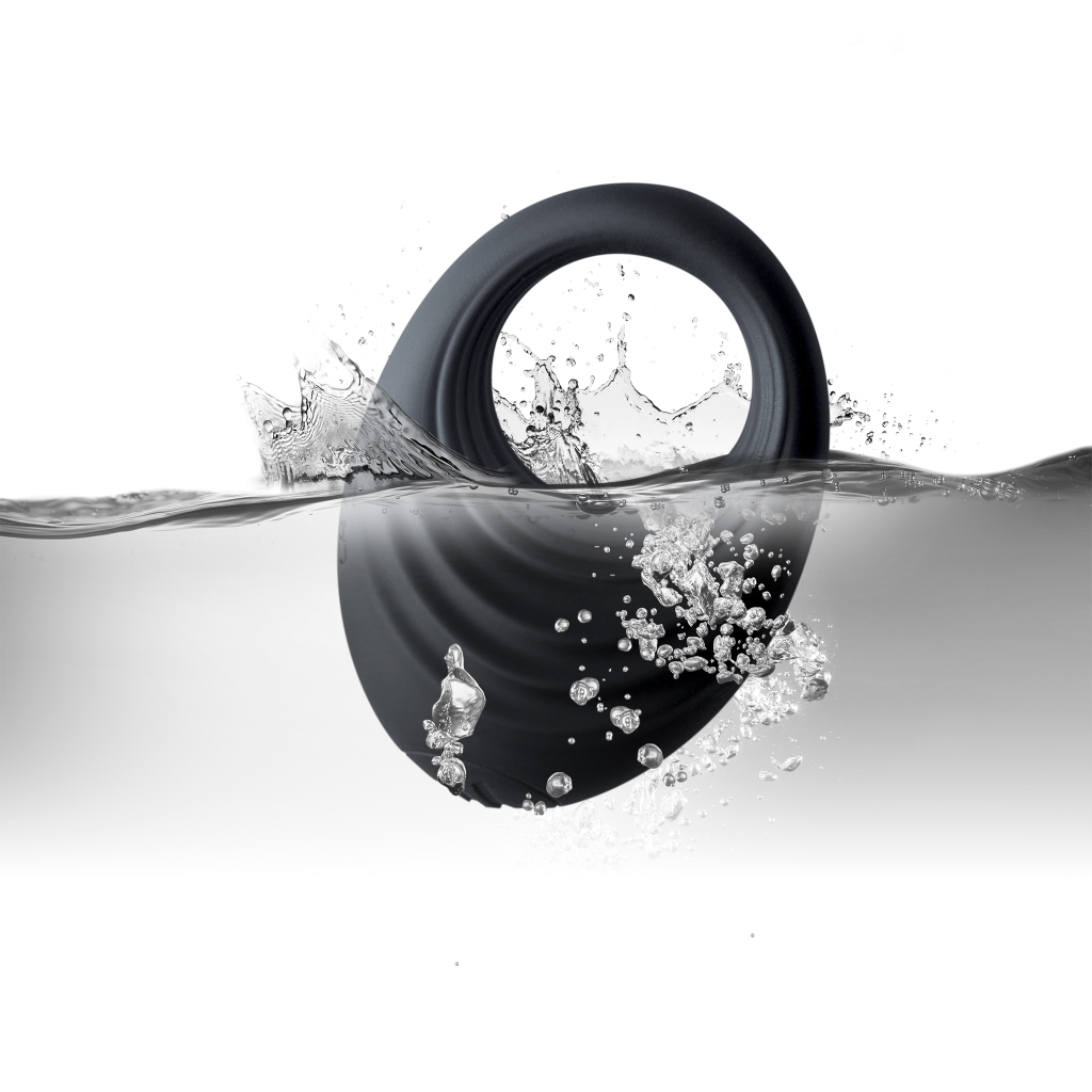 Black silicone cock ring with splash effect and scattered water droplets