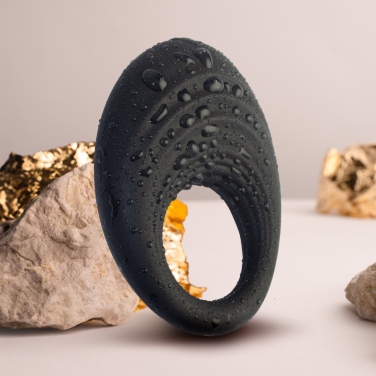 Black silicone cock ring with water droplets, textured ridges