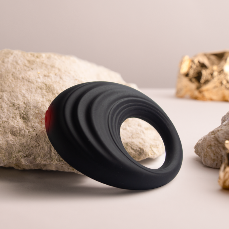 Black silicone cock ring, close side angle with flared rim