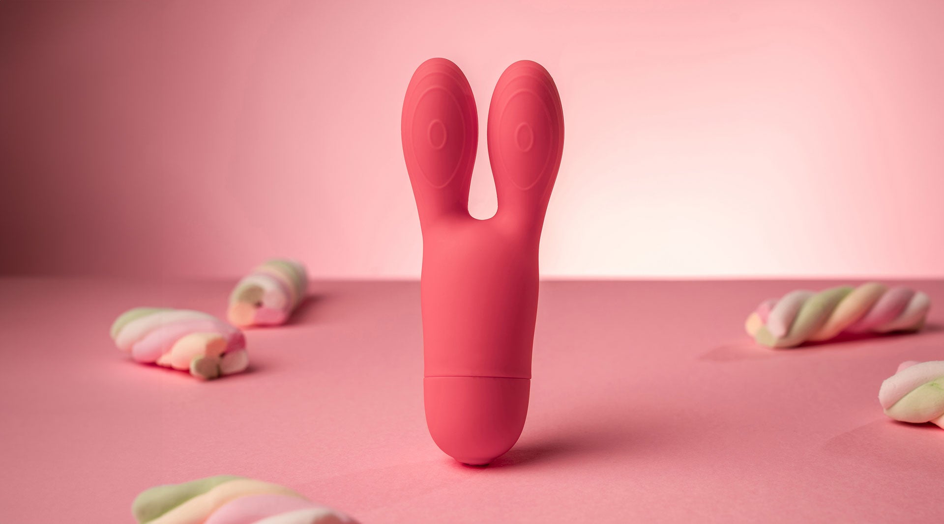 Rabbit vibrator with big flexible ears in coral.
