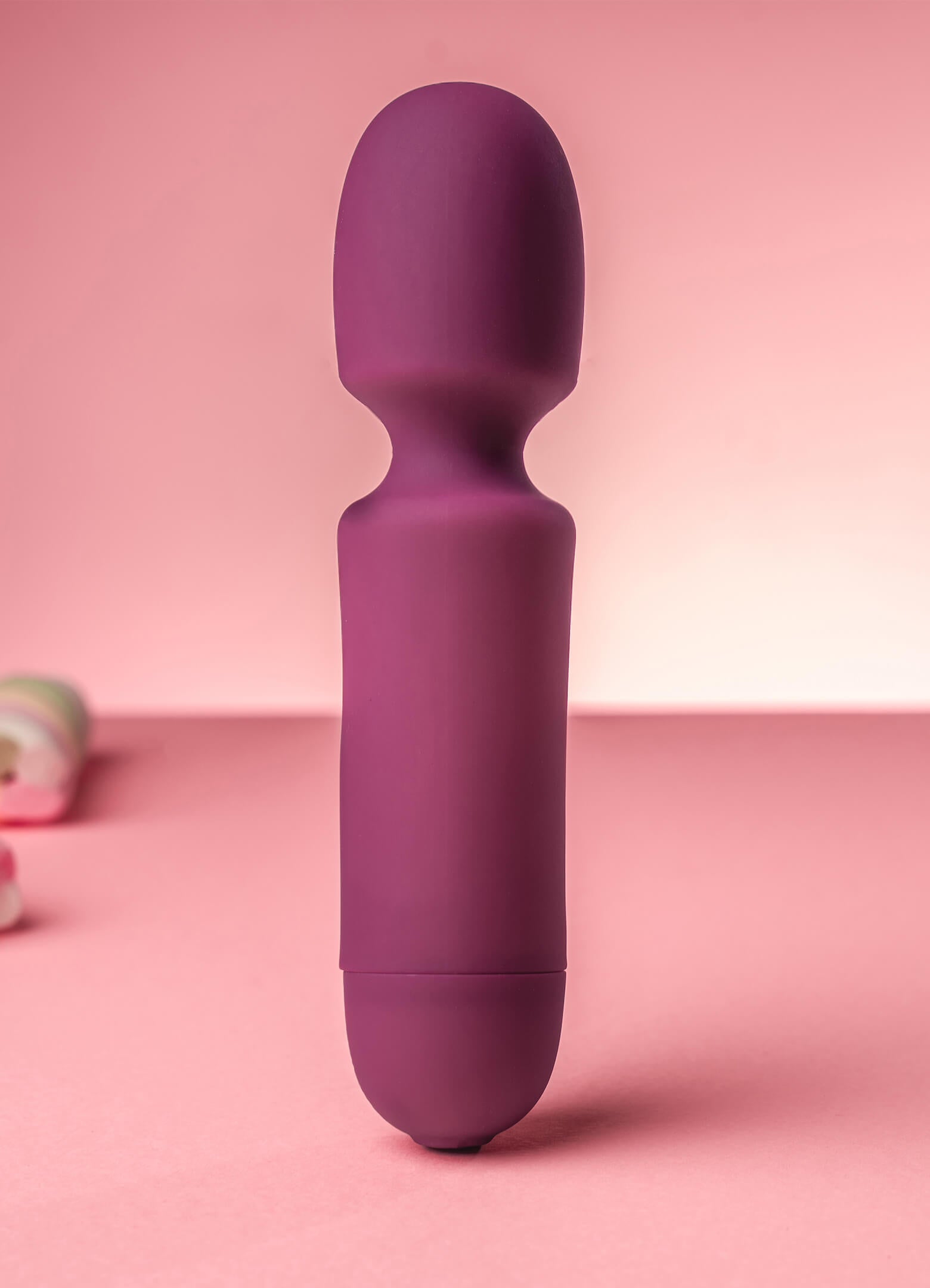 Miniature wand vibrator in burgundy.