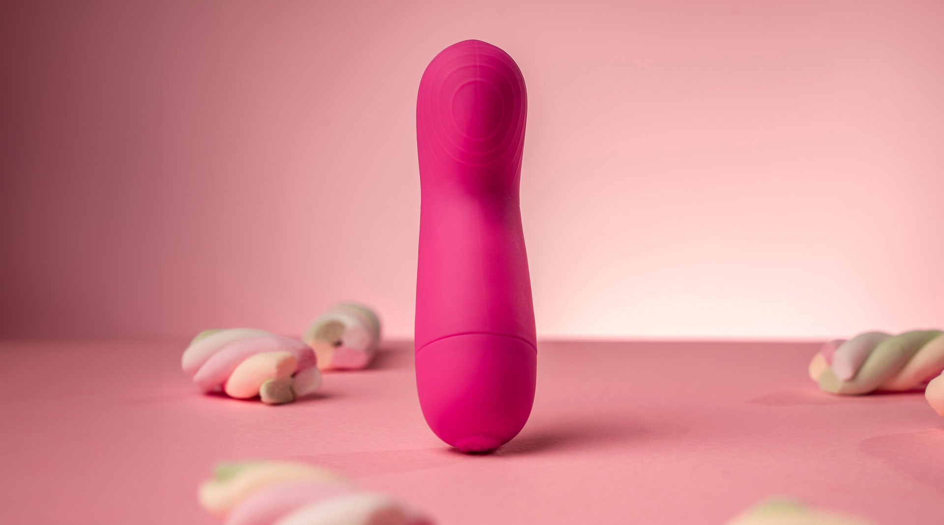 Small discreet G-spot vibrator in pink.
