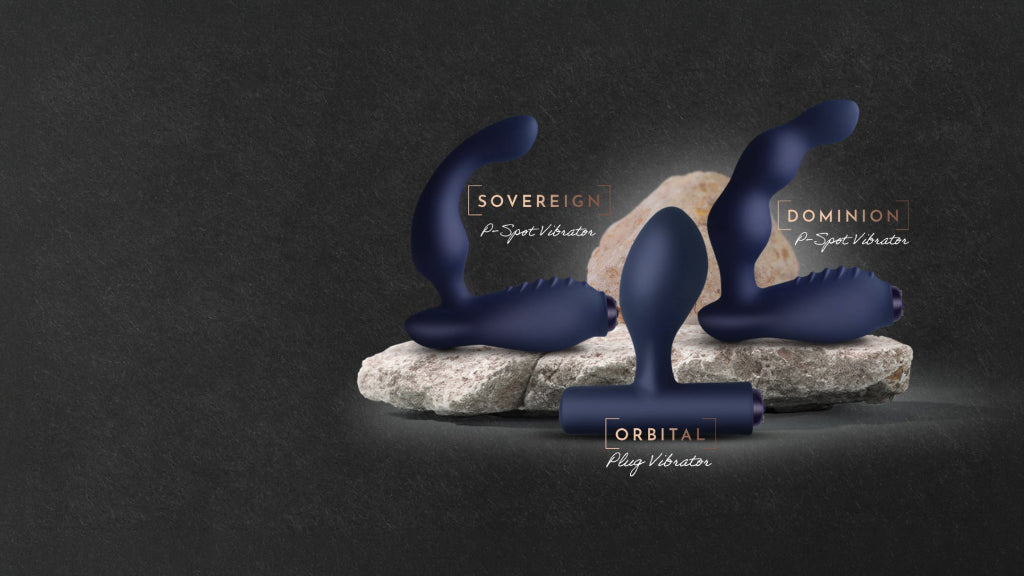 Three dark blue personal massagers displayed on and around a stone pedestal against a dark textured background. The products are labeled Sovereign, Dominion, and Orbital with text overlays.