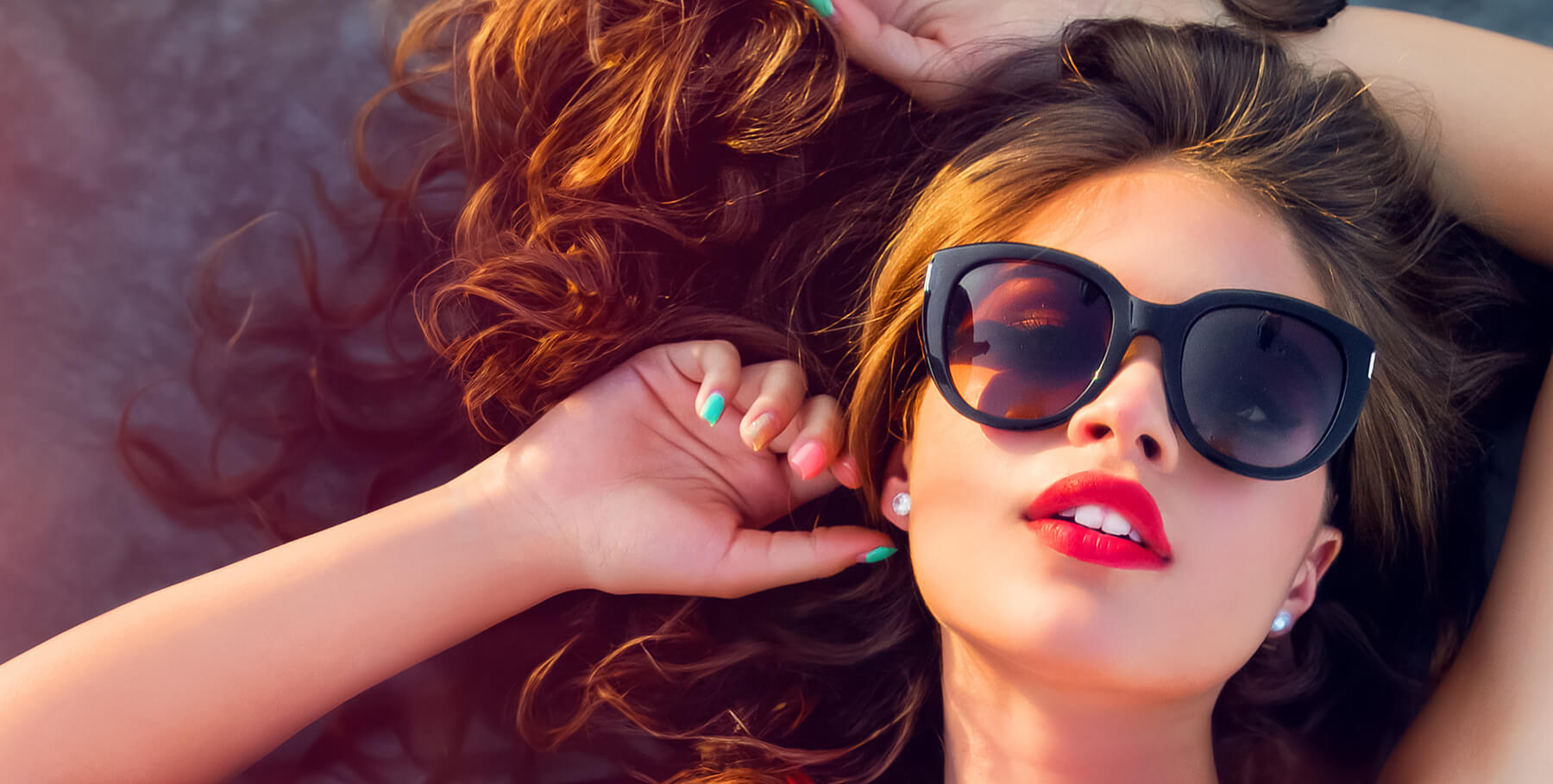 beautiful woman in sunglasses relaxing in the sun