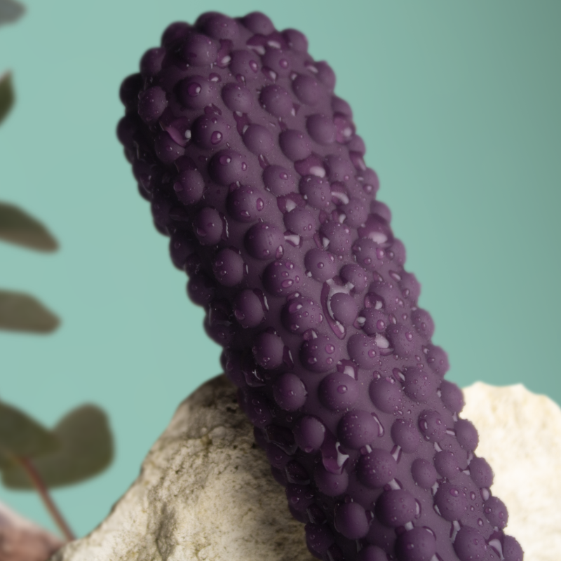 Purple textured silicone massager with water droplets and bubble nubs
