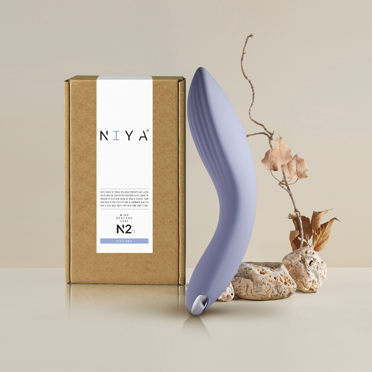 Curved purple silicone personal massager with retail box and insert