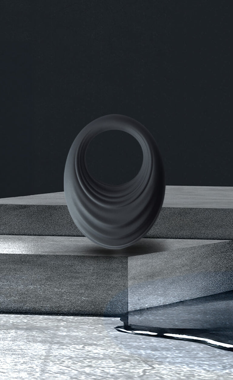 Cock-Ring called "Spire" on a textured podium