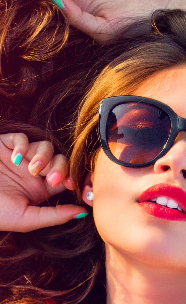 beautiful woman in sunglasses relaxing in the sun